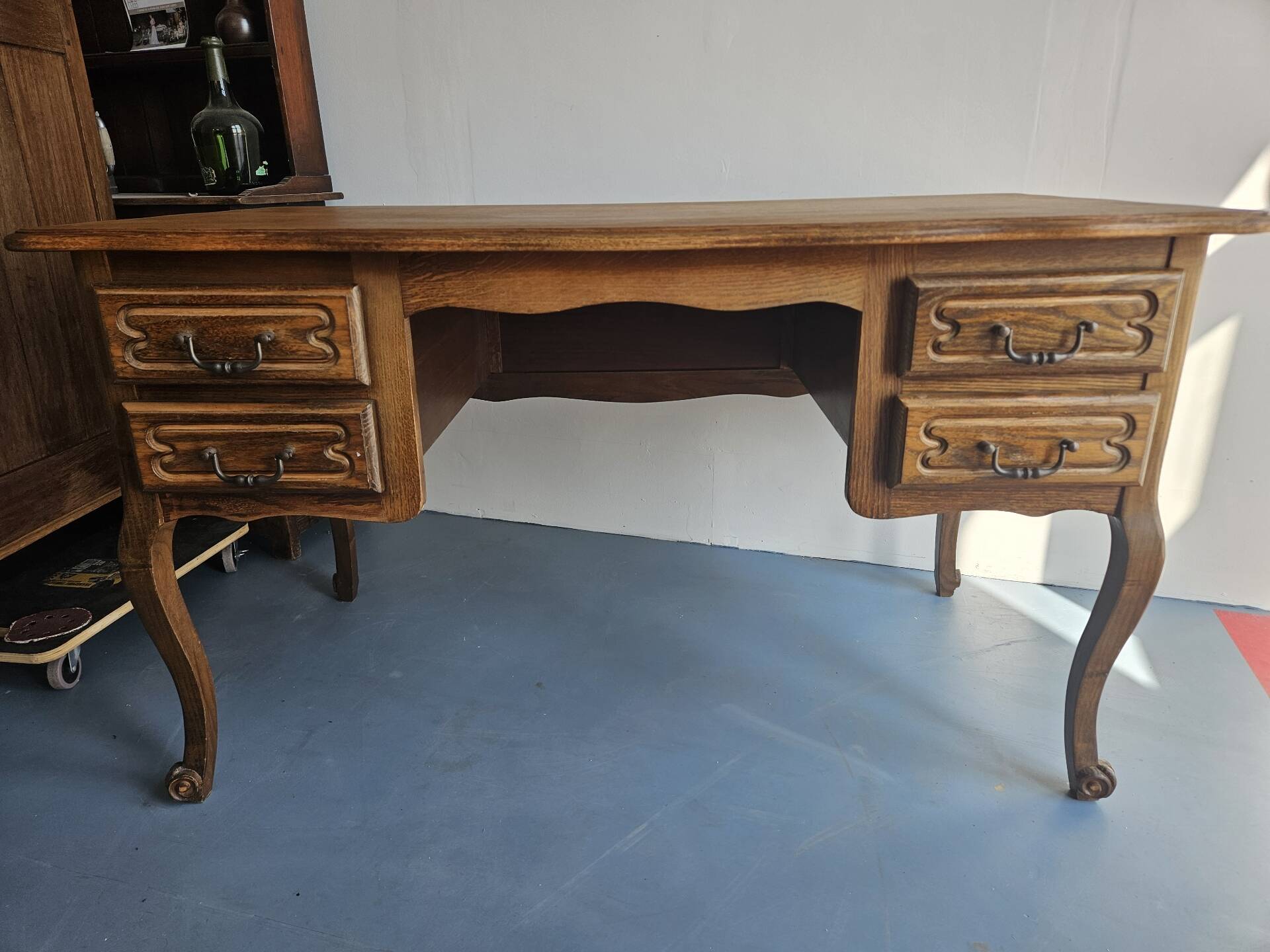 Antique wooden desk with 4 drawers.