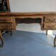 Antique wooden desk with 4 drawers.