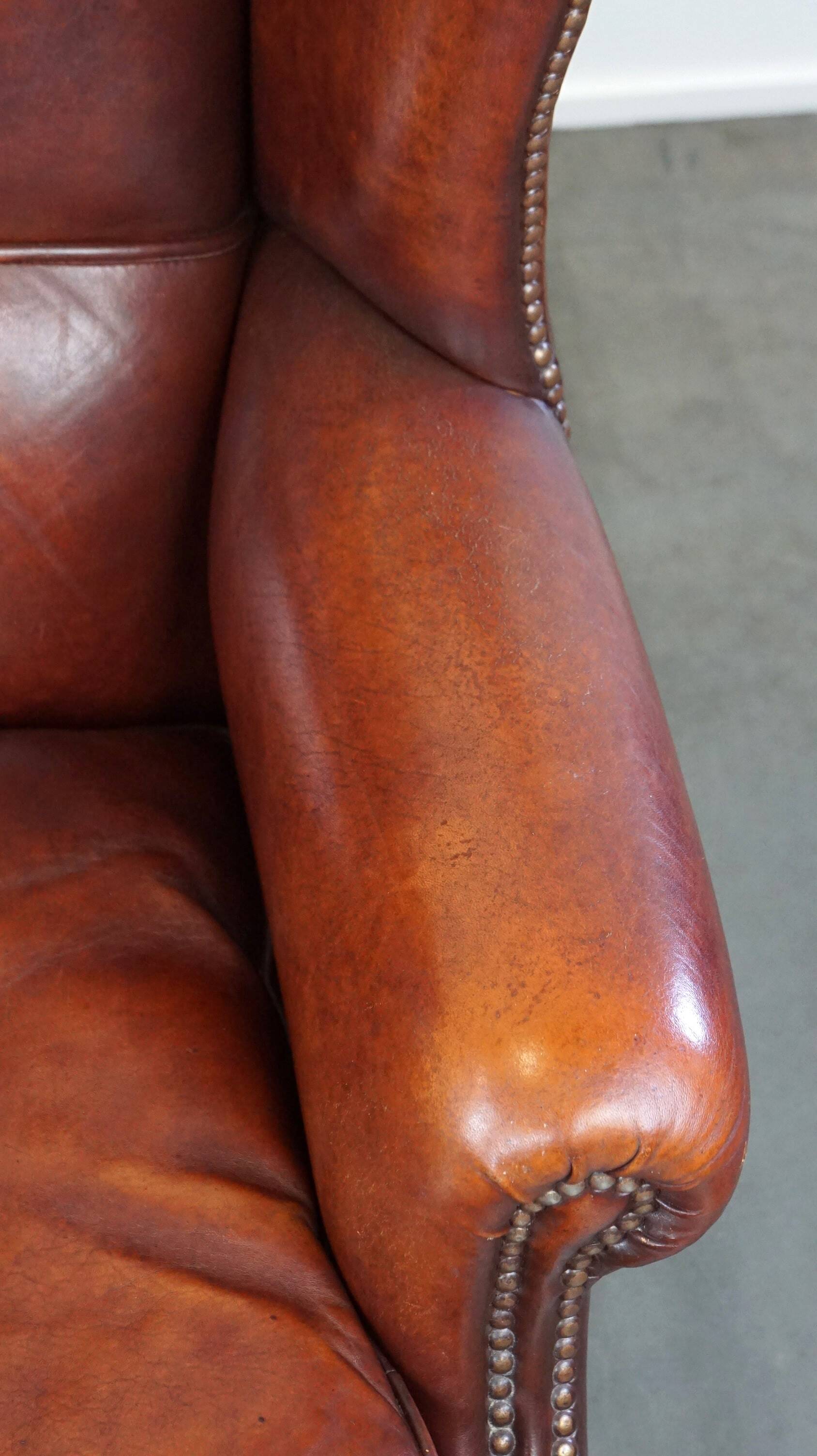 Large comfortable sheepleather wingchair in good condition and beautiful colours