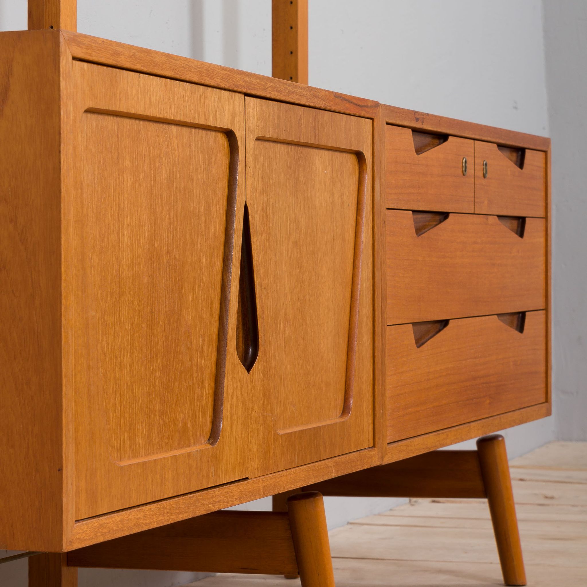 Rival 2 bay free standing teak wall unit with 3 cabinets and 3 shelves by Brodrene Jatogs Norway, Kj