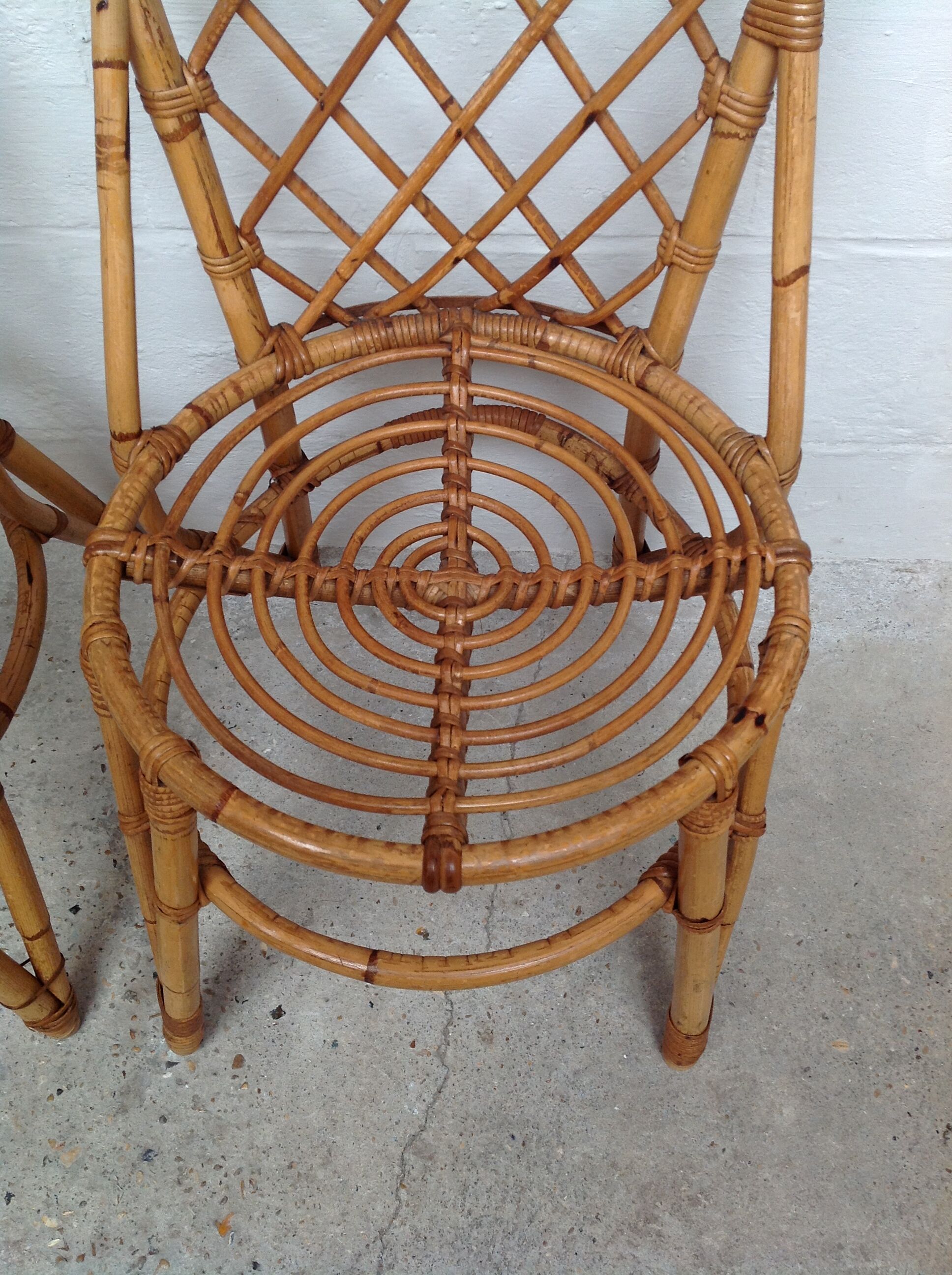 Pair of rattan chairs by Louis Sognot