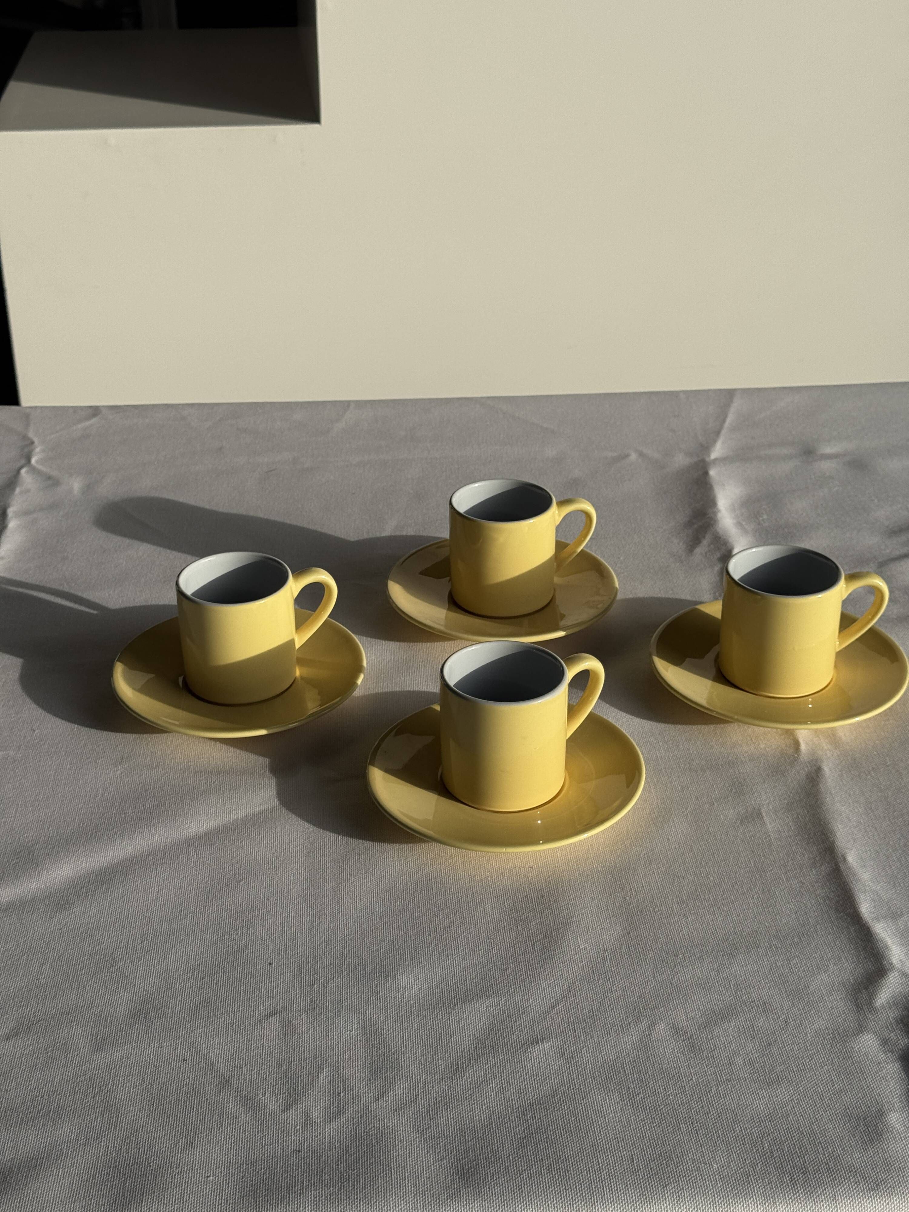 Set of 4 vintage yellow Italian espresso cups and saucers.