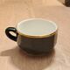 Green and gold coffee cups and sub-cups