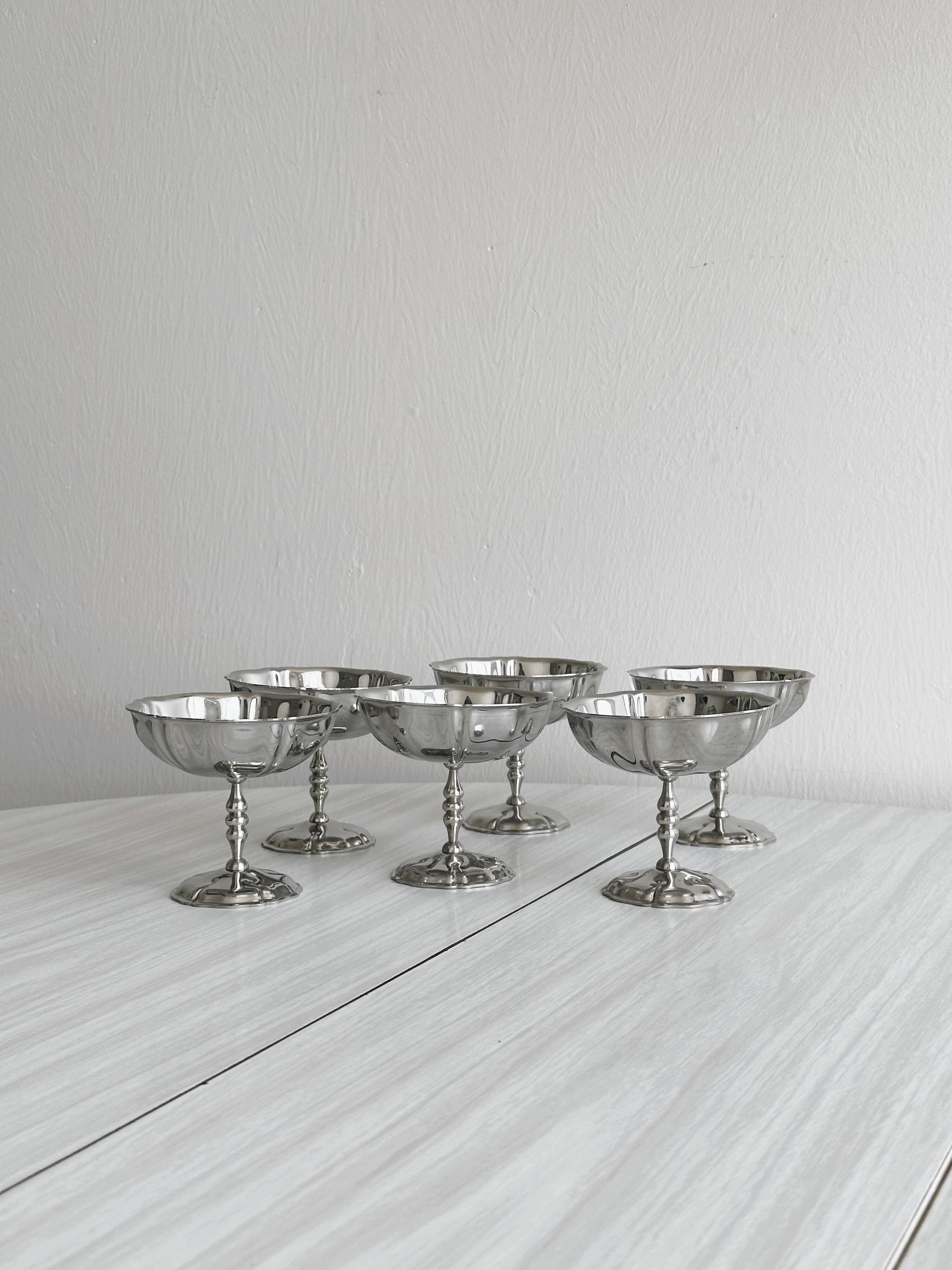 6 silver stainless steel bowls.