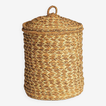 Hand-woven laundry basket in natural rush