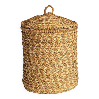 Hand-woven laundry basket in natural rush