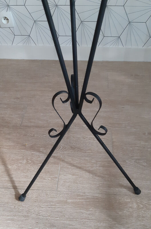 Plant holder in black wrought iron.