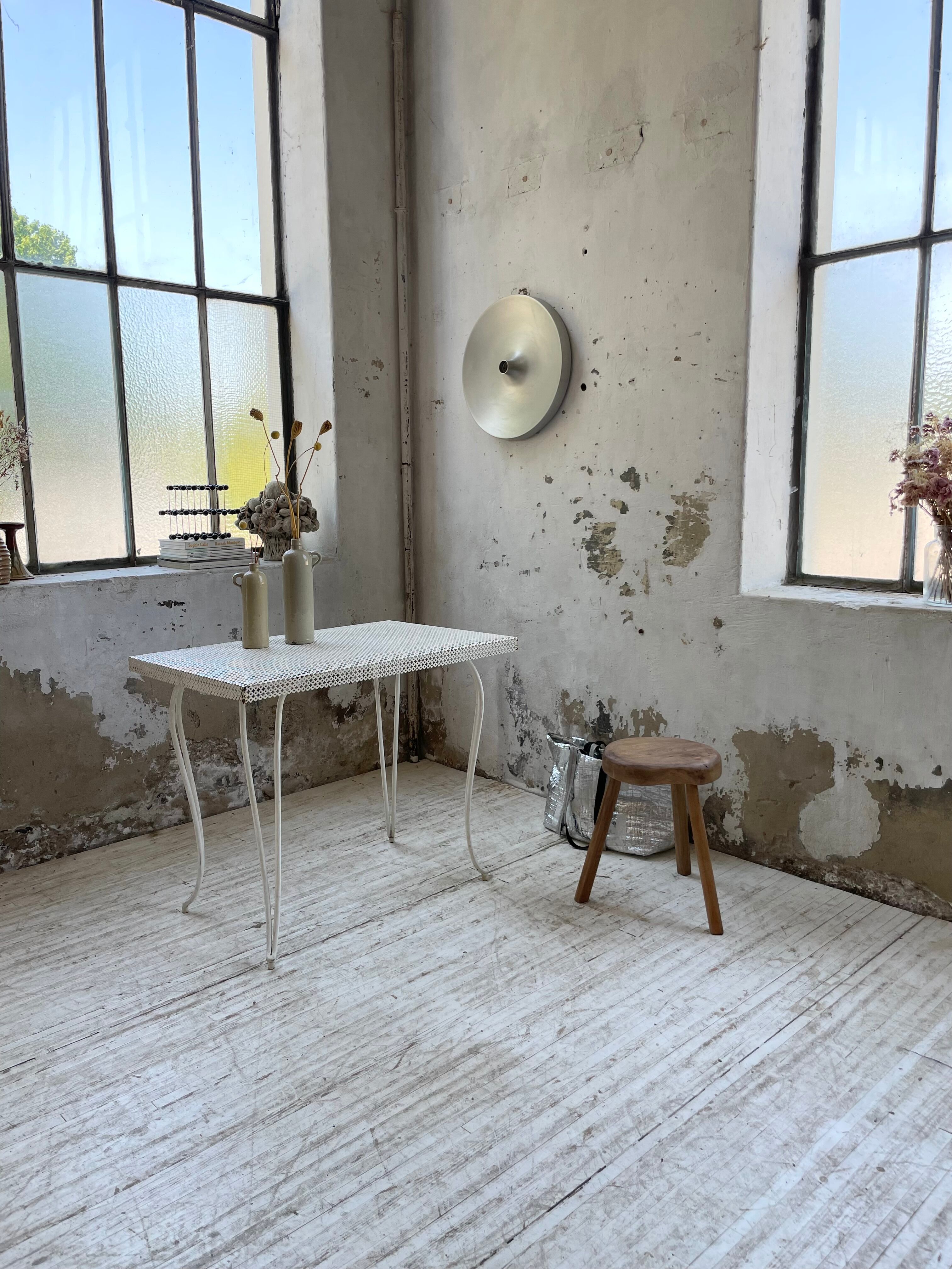 Perforated garden dining table