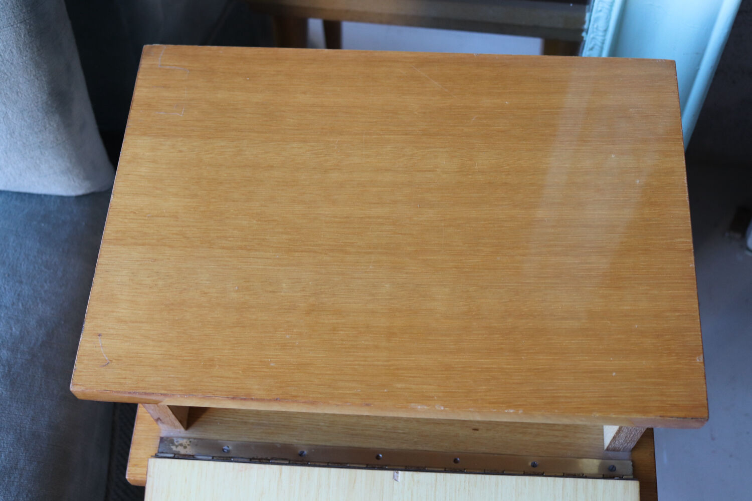 Modernist bedside table from the 1950s with compass legs.