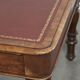 Antique English writing desk from the 19th century with a red leather top