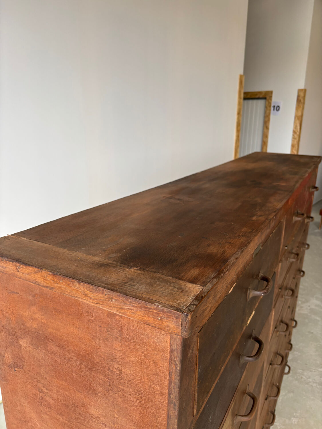 Large wooden workshop cabinet with 16 drawers, antique from the early 1900s.