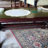 Living room coffee table with green leather and wood top
