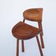 Set of two hand-carved wooden stools with sculpted seats