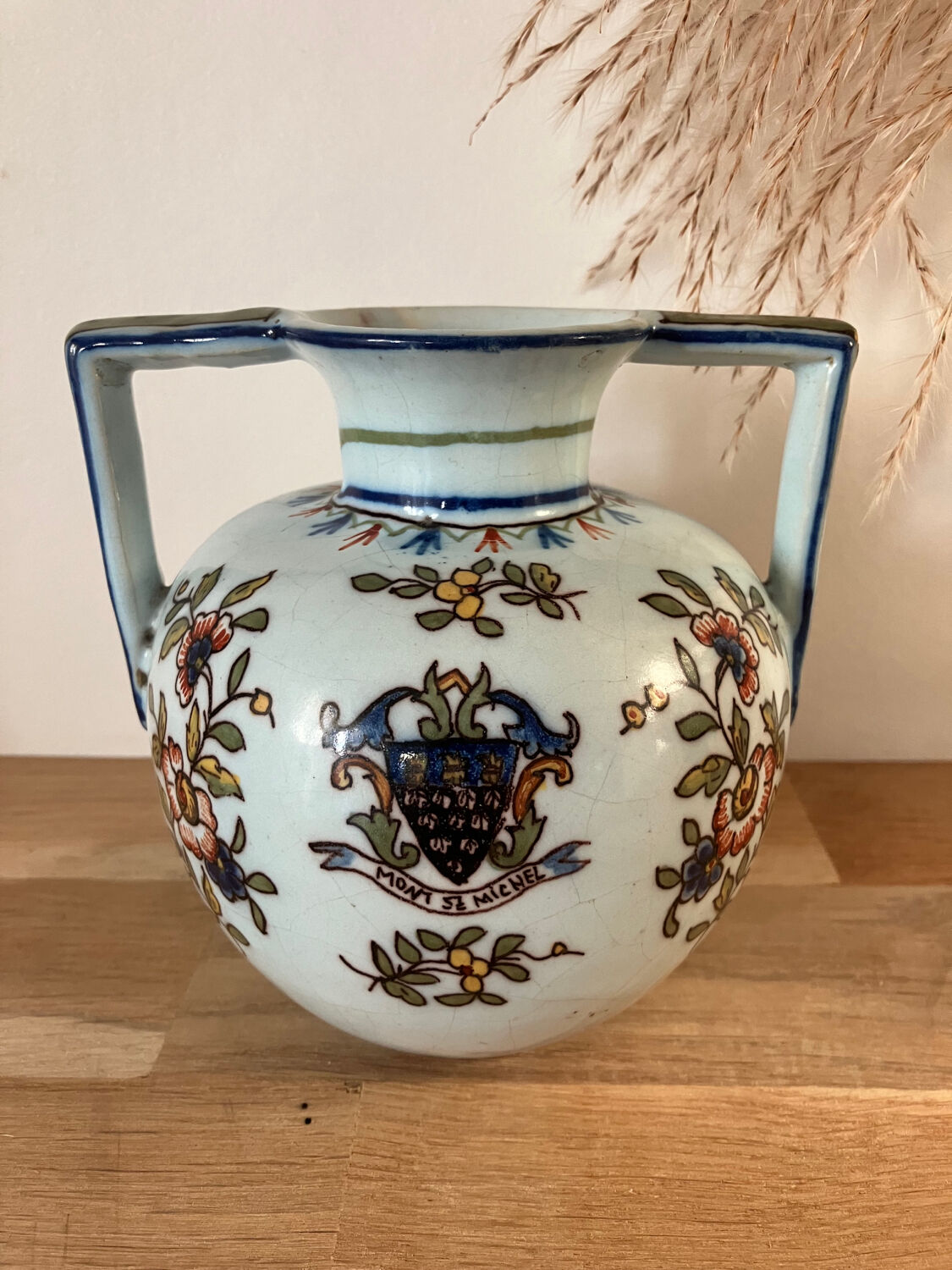 Old vase with floral motif inspired by desvres earthenware