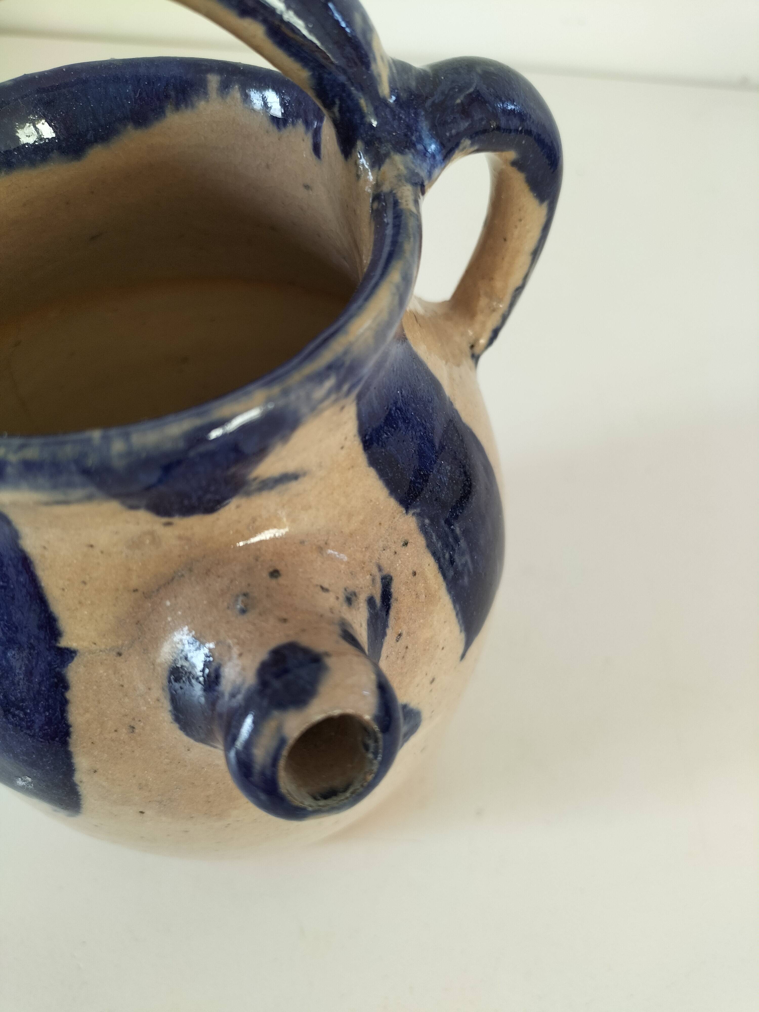 Old pitcher (goat) in cobalt glazed earthenware