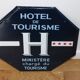 Enameled sign “tourist hotel” 4 stars
