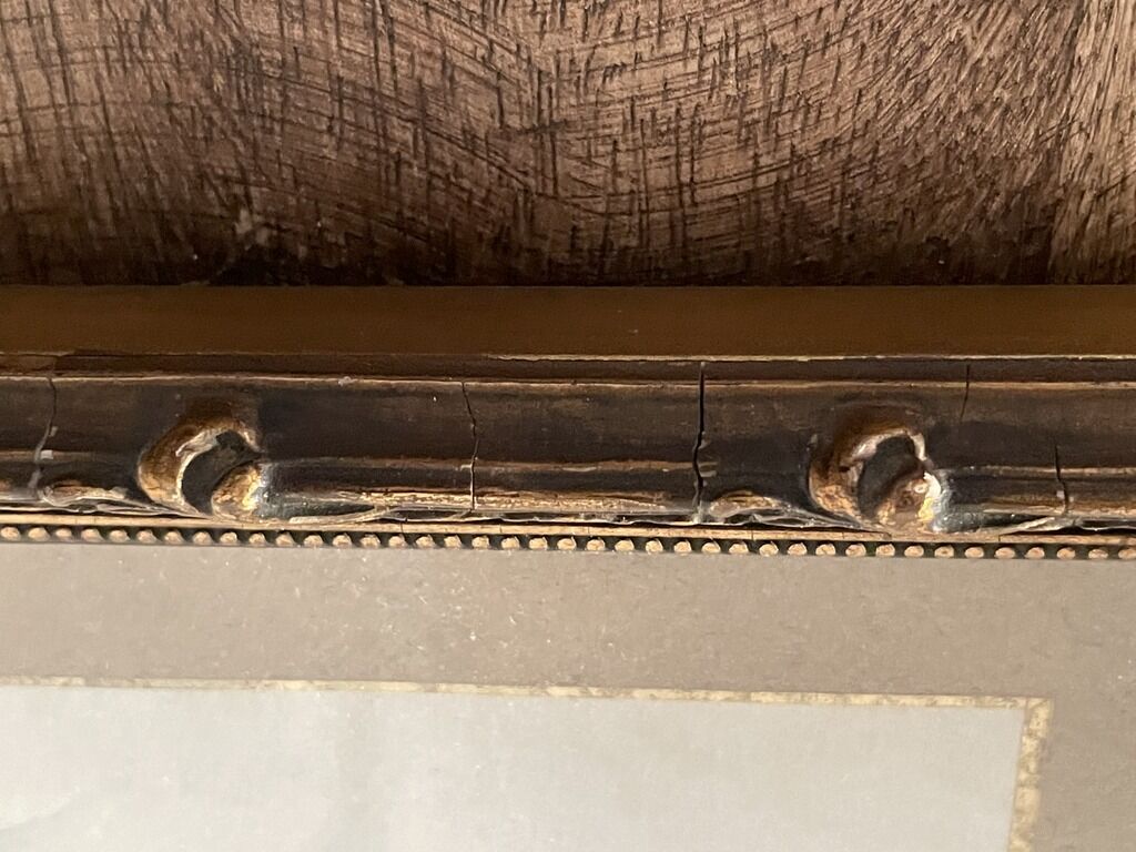 Old wood frame with a gold finish