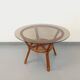 Table basse ronde vintage en verre fumé et rotin des années 70