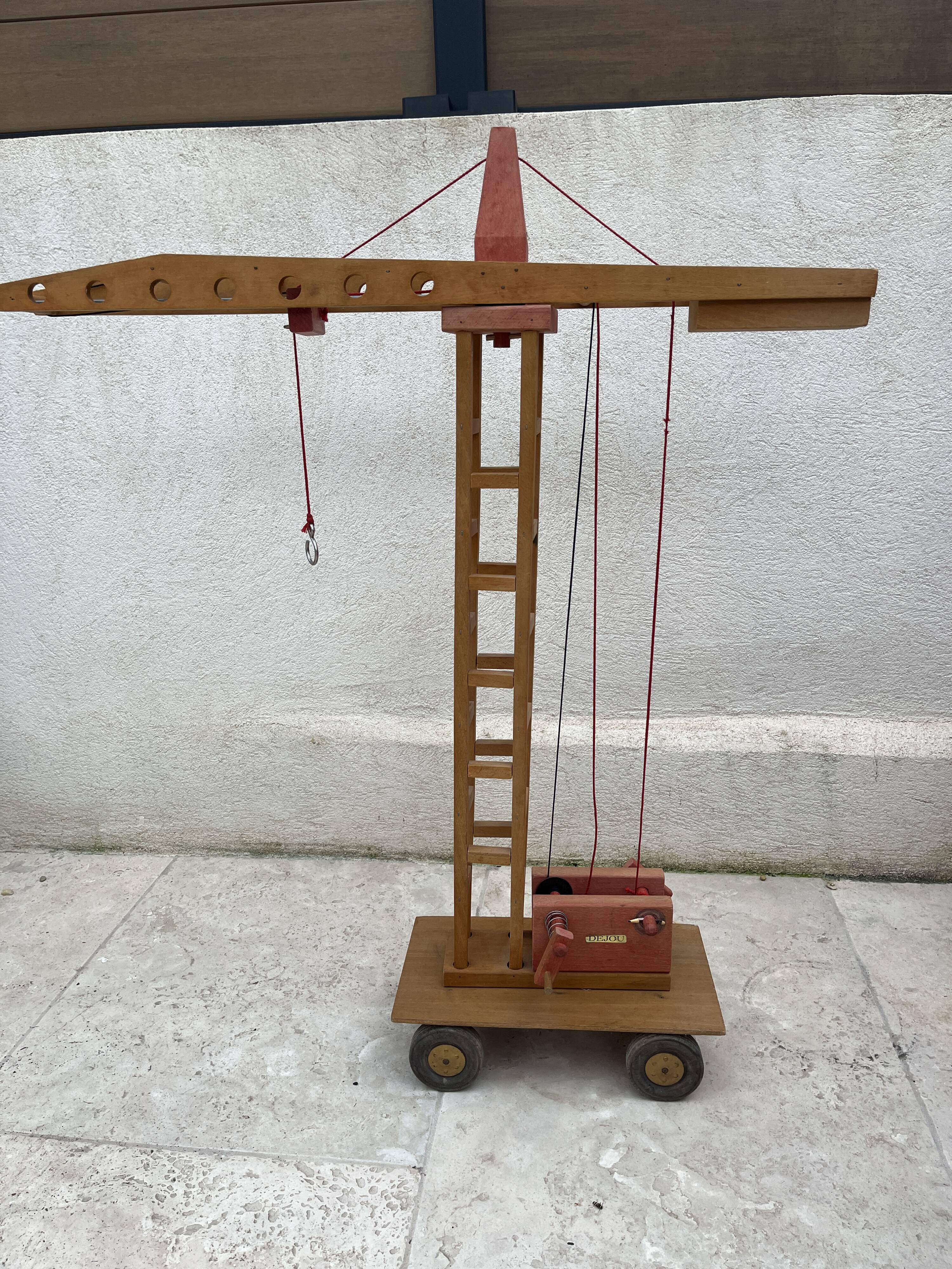 Vintage wooden crane toy from the 60s
