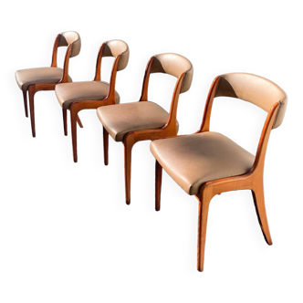 Lot of vintage chairs in Scandinavian style in wood and skai