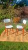 vintage wooden chairs with white faux leather