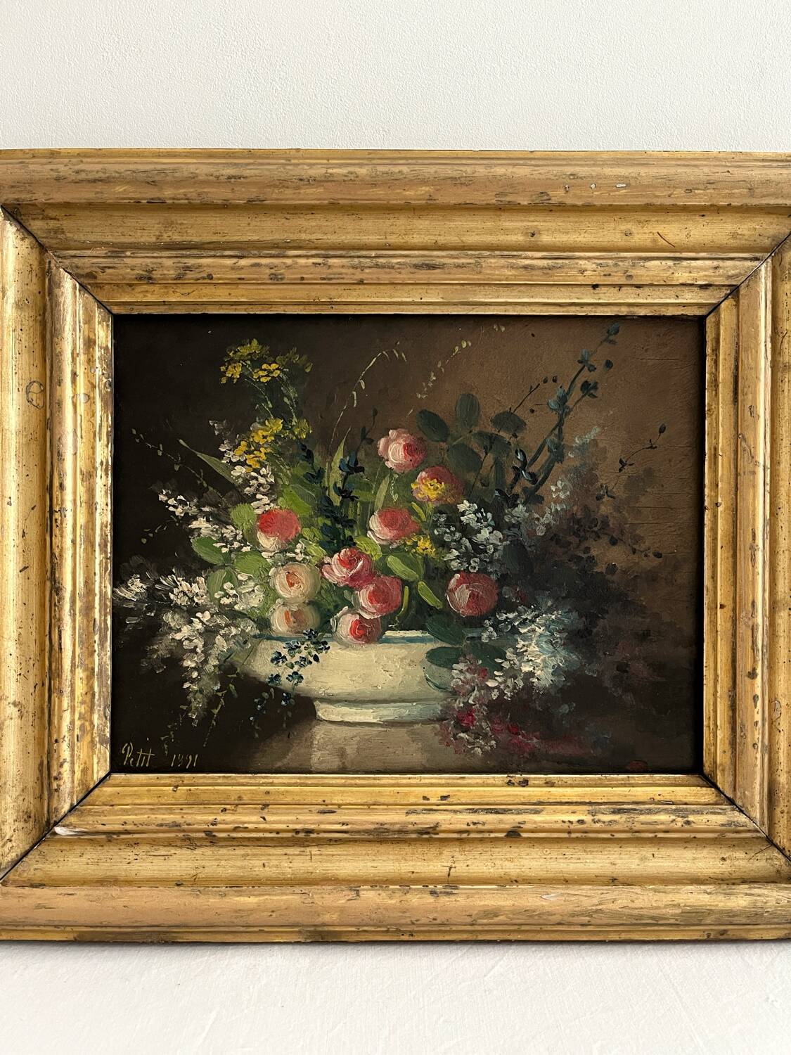 Old oil painting on wood of a bouquet of flowers signed Petit.