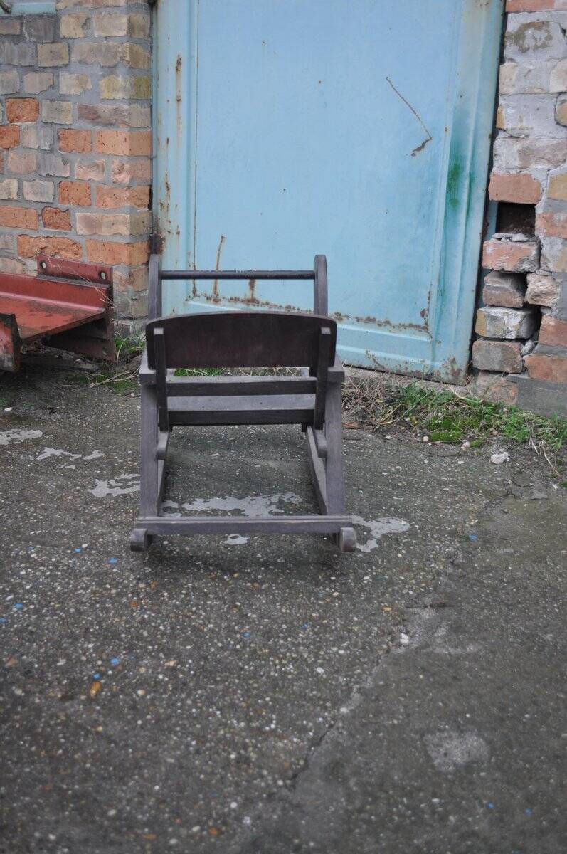 Vintage wooden rocking horse in painted brown — 1950s, Czech Republic