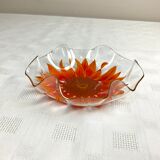 Glass cup with orange sunflower