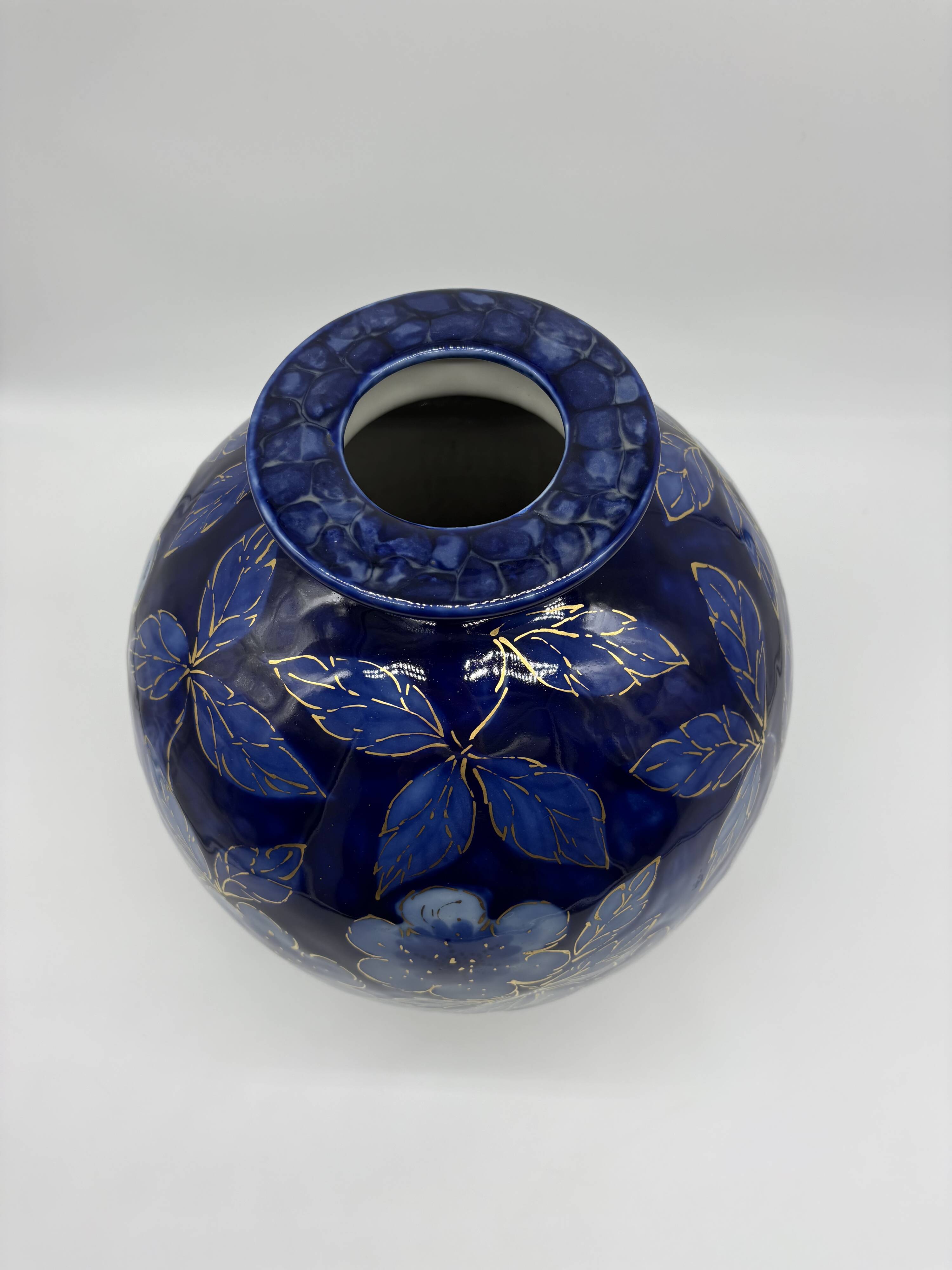 Large Tharaud Limoges vase in cobalt blue porcelain with floral decoration.