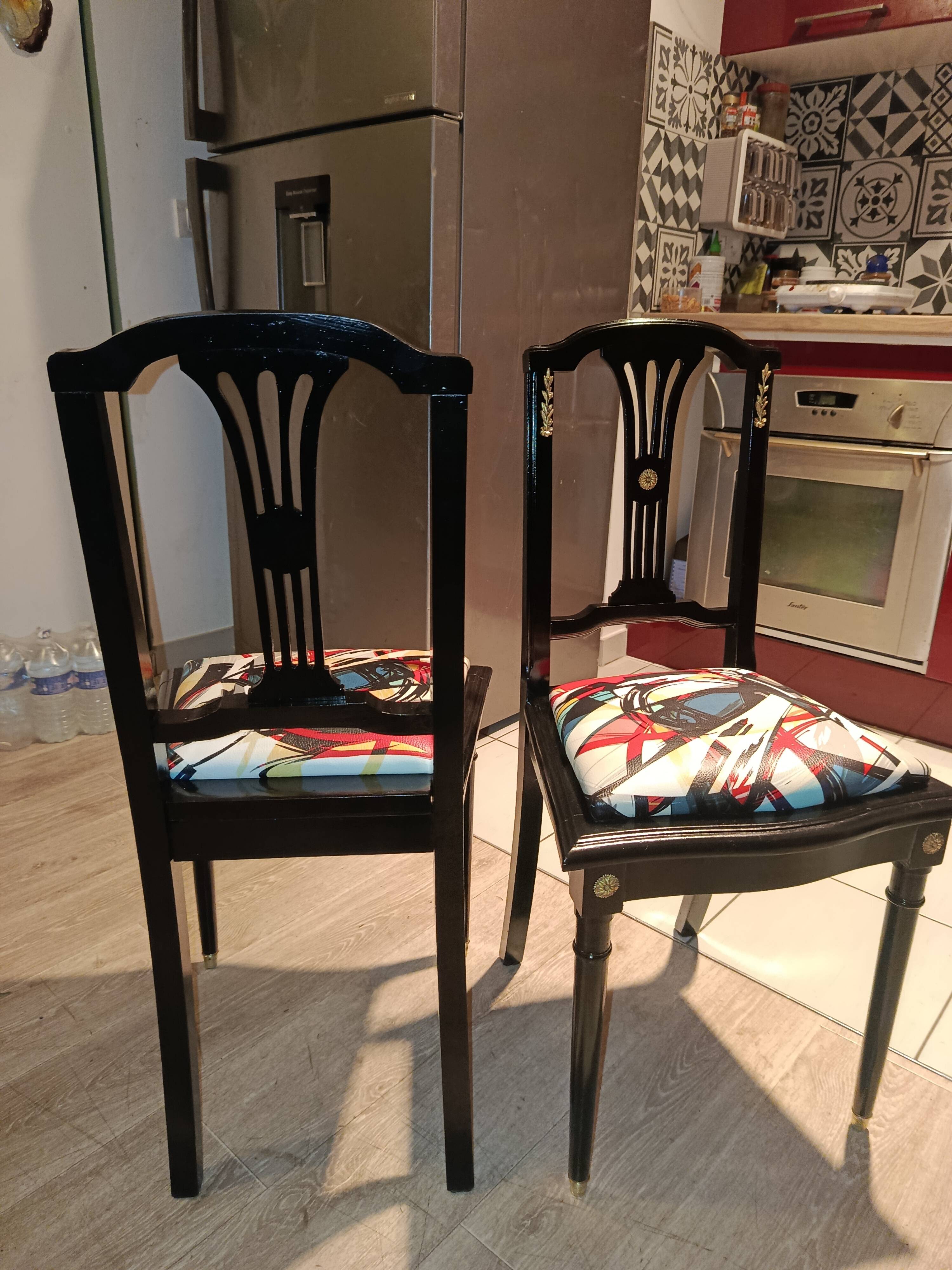 Pair of Hepplewhite neoclassical style chairs, relooked in black lacquer and faux leather.