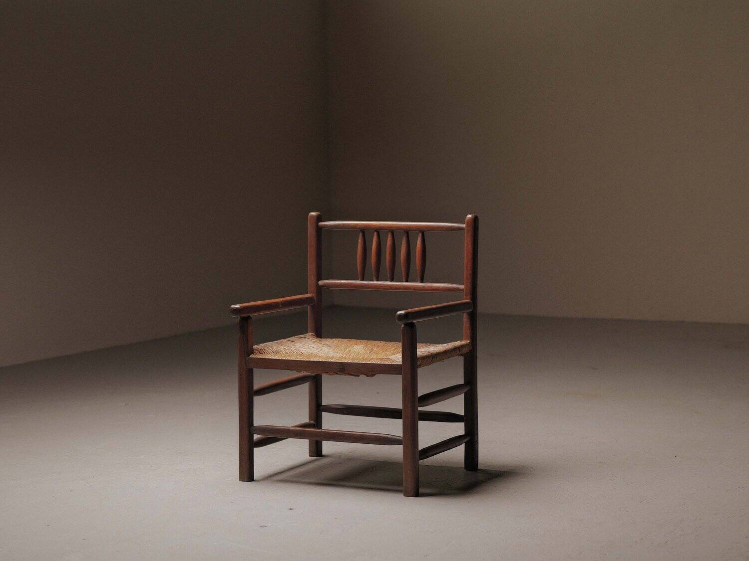 Wicker armchair in solid wood, handcrafted, France, around 1950.