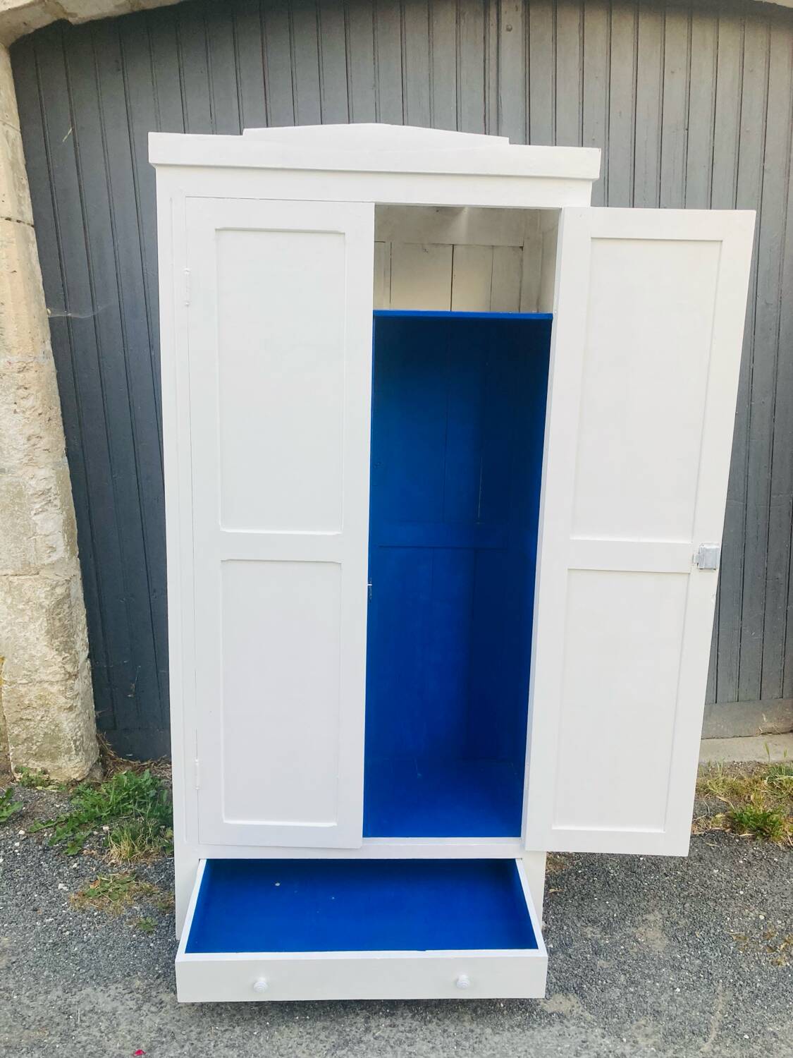 Antique white Parisian wardrobe with Majorelle blue interior