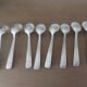 Box of 8 small art deco spoons in silver metal