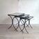 Set of 3 black wrought iron side tables with gold-coloured accents, 1950s