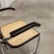 Fauteuil b64 Breuer noir cannage accoudoirs et tampons neufs