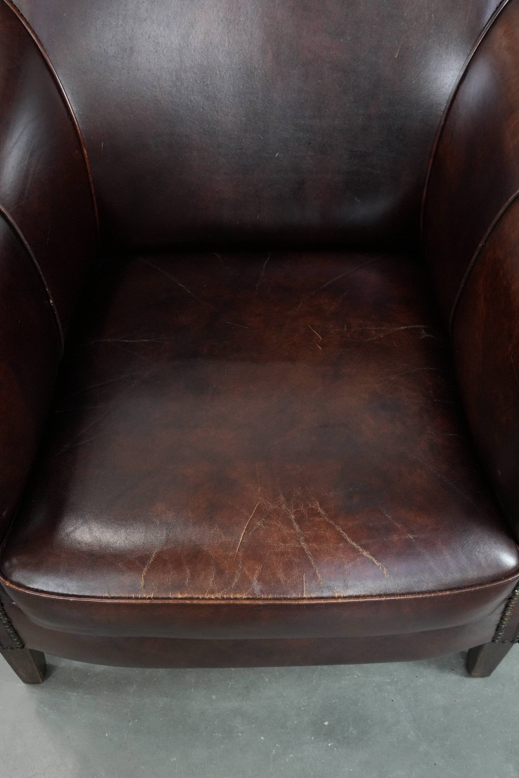 Characterful and comfortable cowhide leather armchair