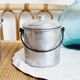 3 mismatched milk jars