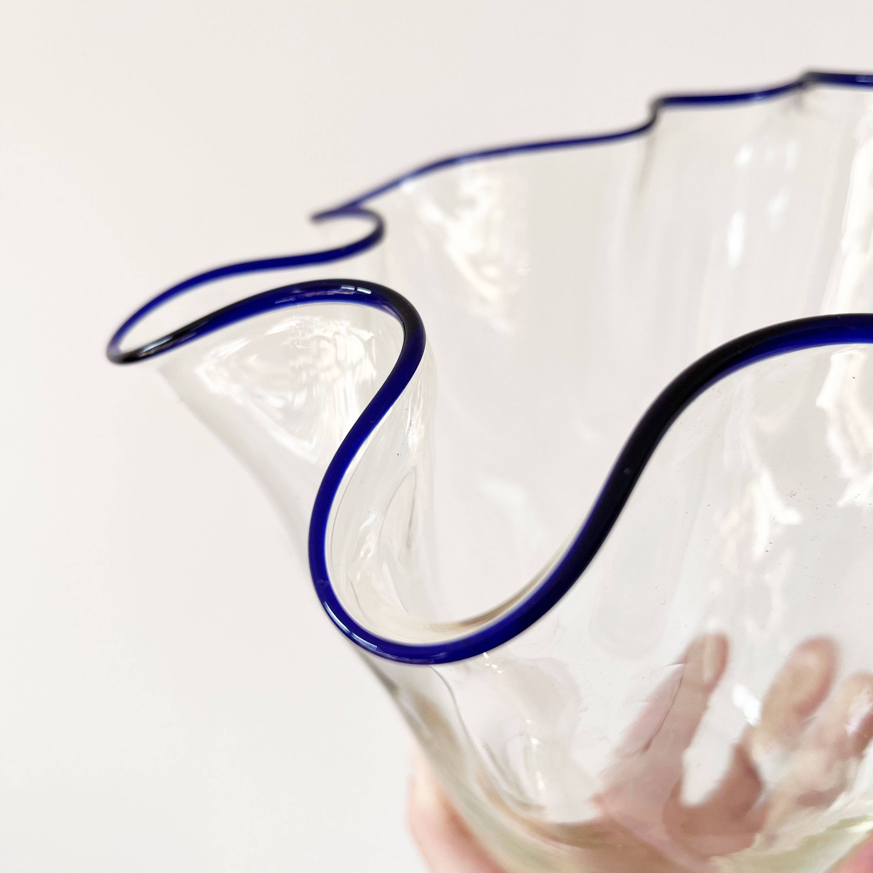 Blue-edged blown glass handkerchief vase