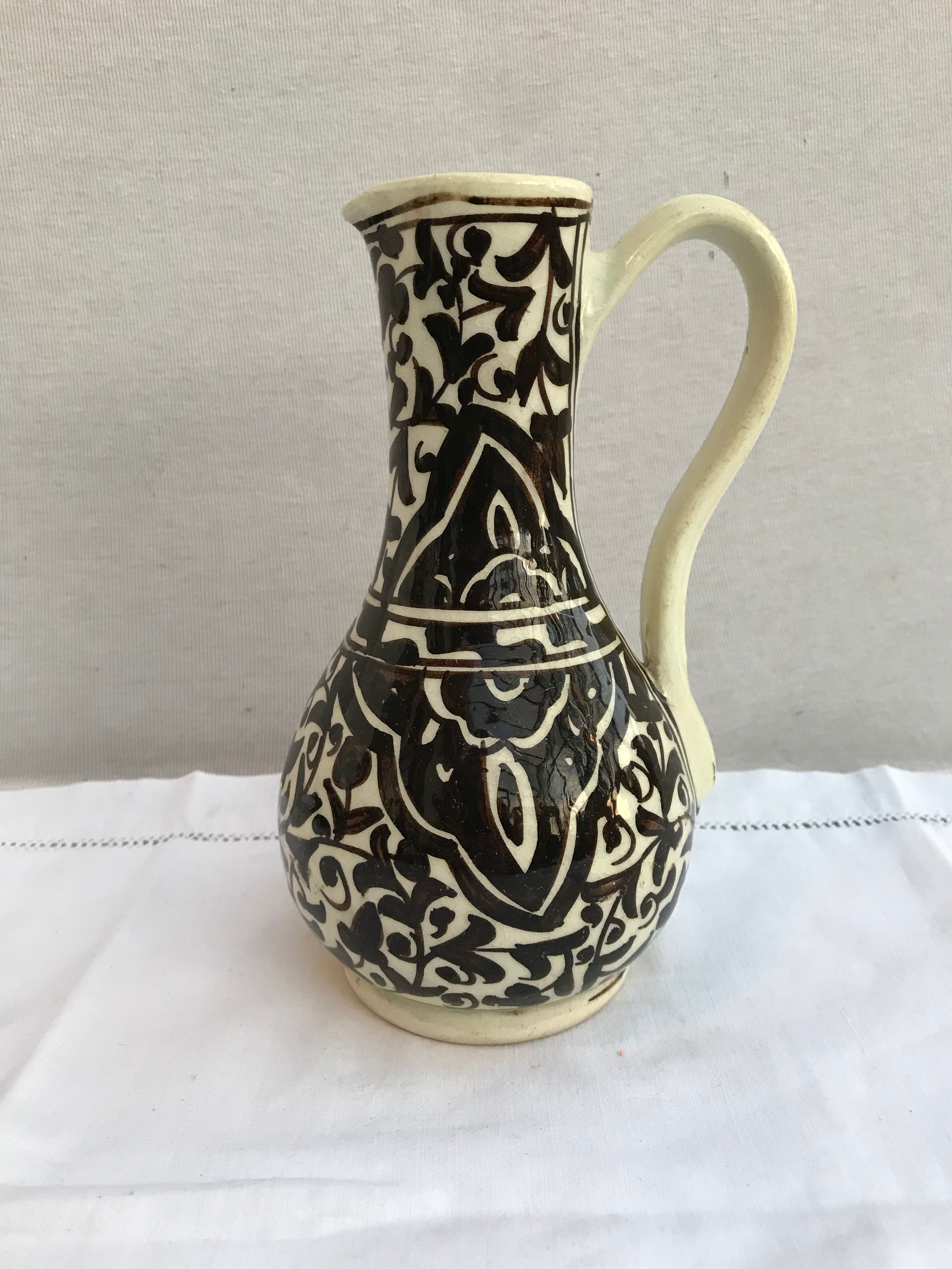 Former beige cracked ceramic pitcher