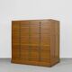 Vintage industrial oak filing cabinet with several drawers, 1930s.
