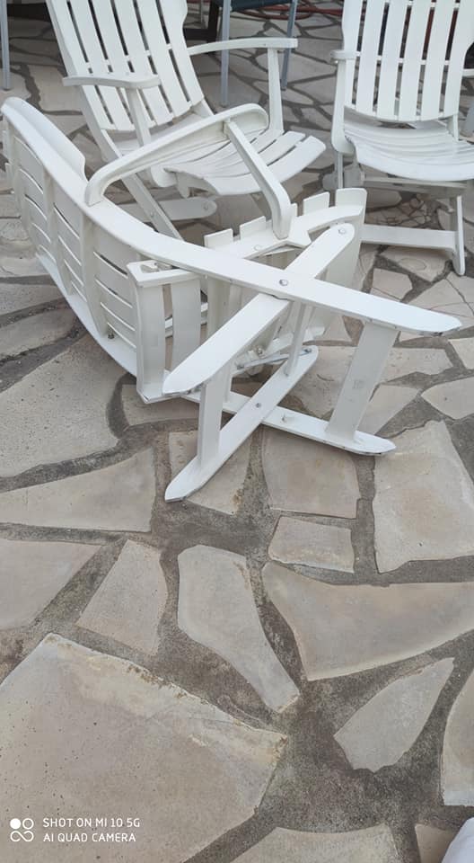 Four Grosfillex armchairs