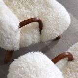 Early pair of arnold madsen clam chairs in curly sheepskin, madsen & schubell, 1944