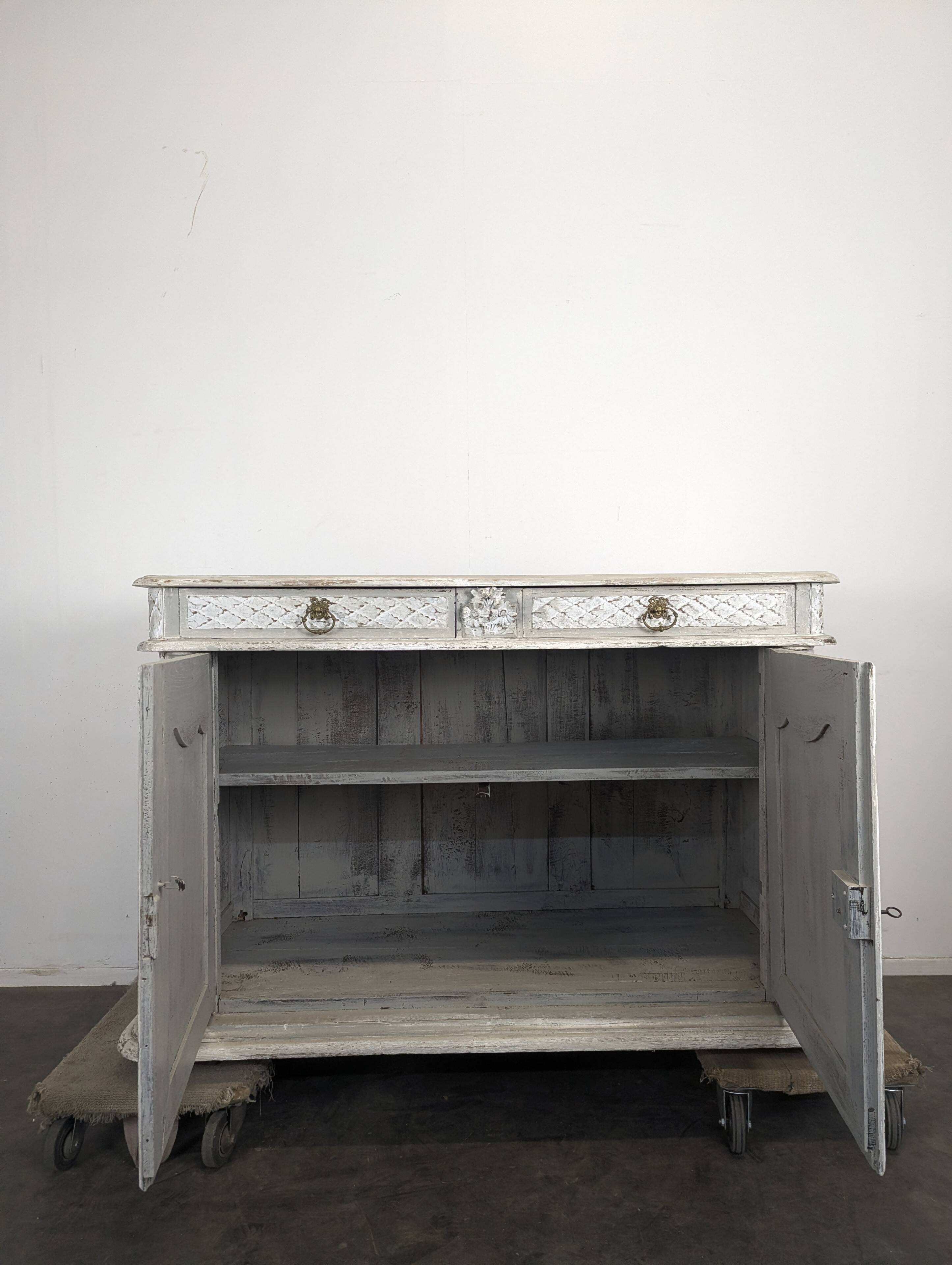 Louis XIII buffet with twisted column in grey patinated oak, two doors, two drawers.