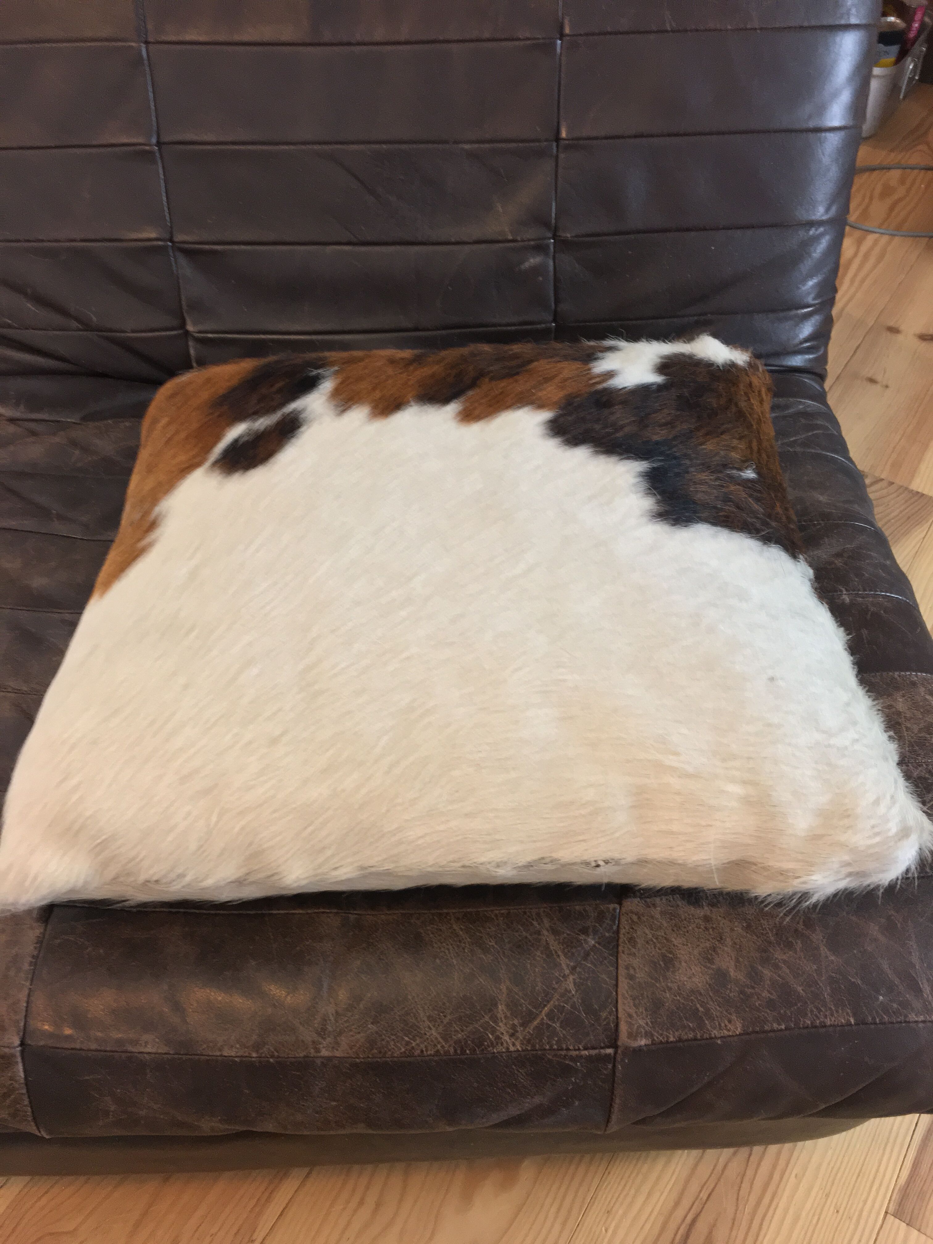 Pouf and cow cushion, leather