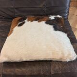Pouf and cow cushion, leather