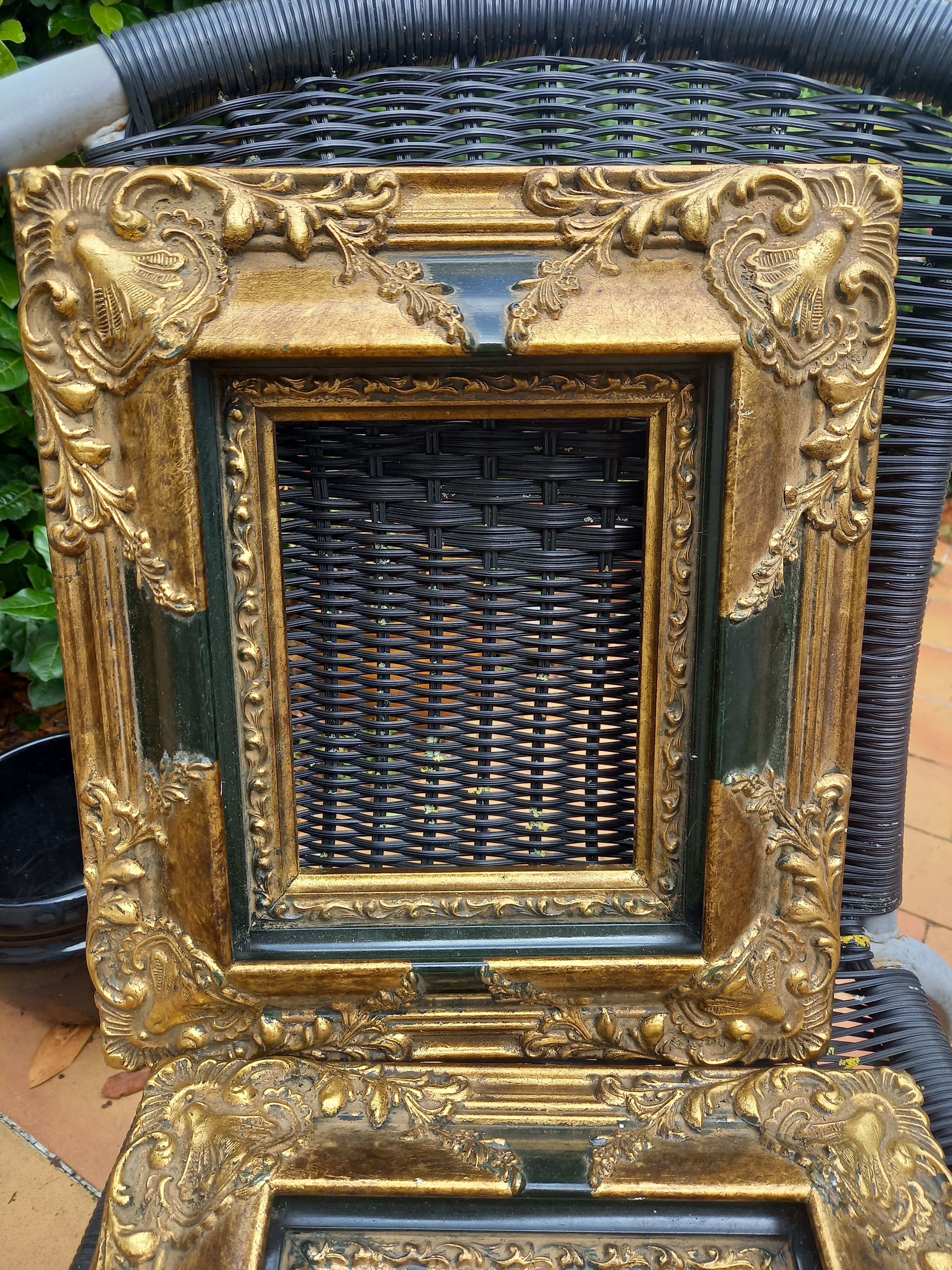 Pair of baroque frames in vintage gilded wood