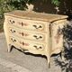 Curved Louis XV style commode in marble with painted floral decoration.