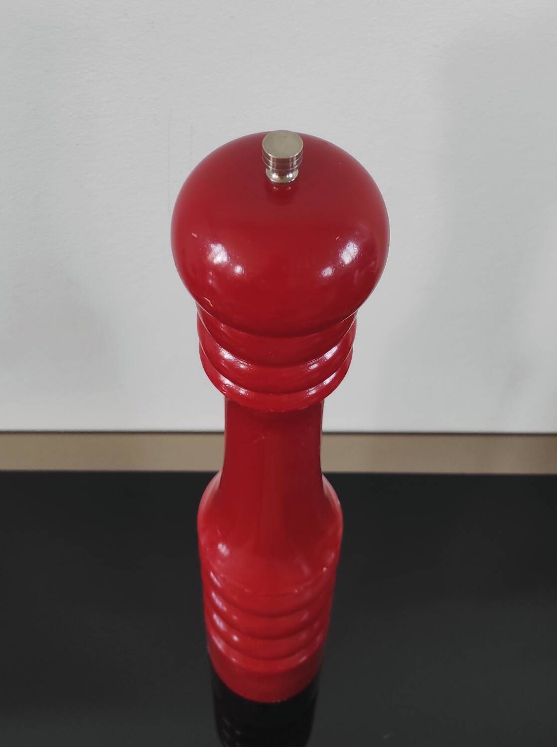 Giant vintage red lacquered wooden pepper mill