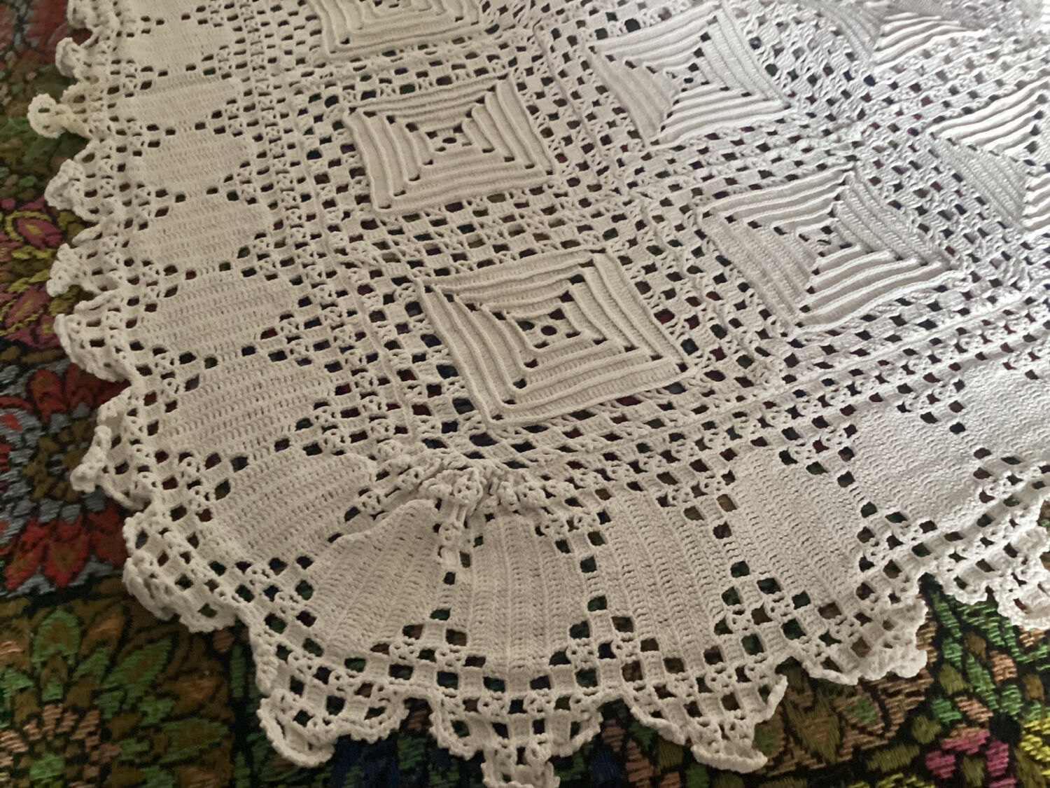 White cotton crochet bedspread with squares