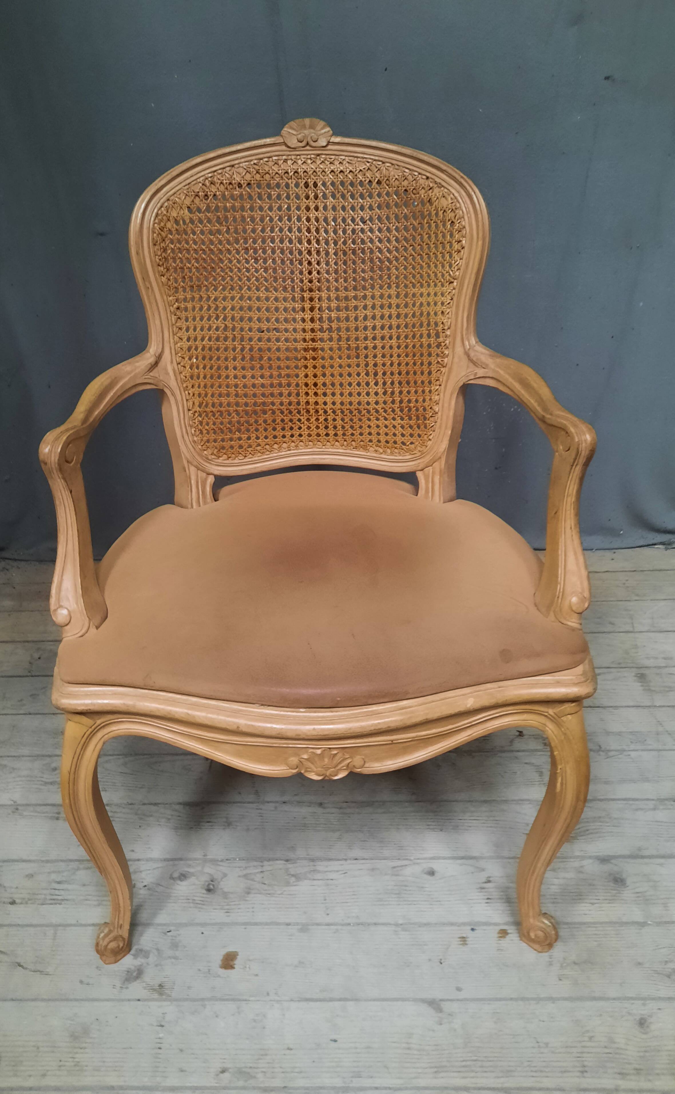 Louis XVI style caned armchair